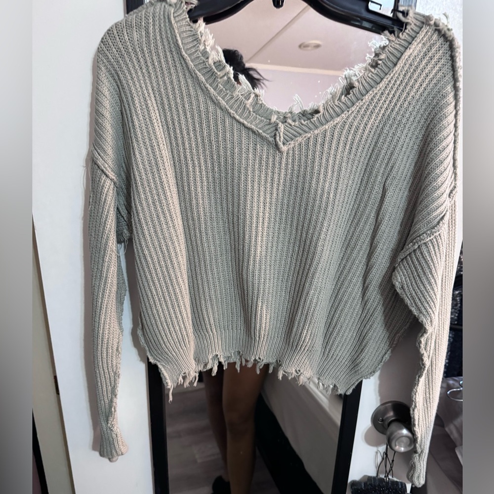 Light grey Jessica Simpson short waisted, not quite cropped sweater.